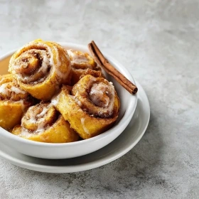 Cooking process for Pumpkin Spice Cinnamon Rolls showing technique and proper timing
